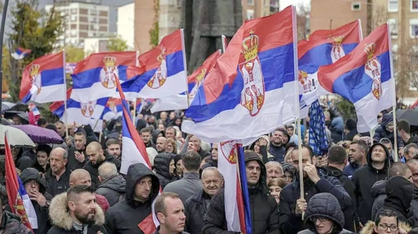 Kosovo Serbs wave Serbian flags during a protest in the Serb-majority municipality of North Mitrovica, on Sunday. — courtesy photo Armend Nimani / AFP