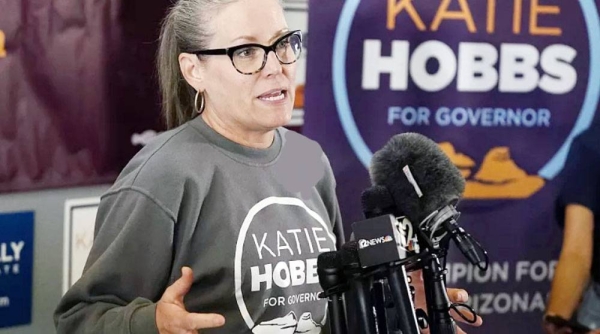 Katie Hobbs speaks to supporters at a campaign event. Hobbs has won in her race for governor against Republican candidate Kari Lake.