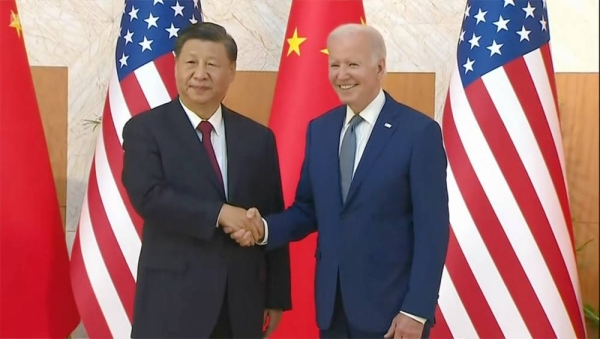 US President Joe Biden, right, stands with Chinese President Xi Jinping before a meeting on the sidelines of the G20 summit.