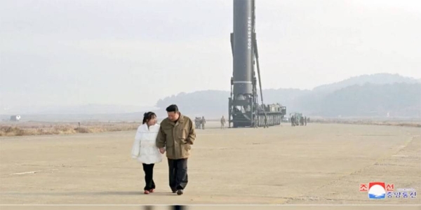 North Korean leader Kim Jong Un, right, and his daughter inspects a missile at Pyongyang International Airport in Pyongyang, North Korea, Friday.