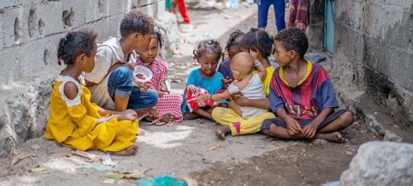 In a neighborhood in Aden, Yemen, a three-year-old girl (center) plays with neighborhood friends after losing her twin sister to measles. – courtesy UNICEF/Saleh Hayyan
