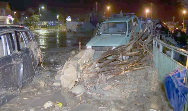 Damaged vehicles are seen after heavy rain triggered landslides that collapsed buildings and left up to 12 people missing, in Casamicciola, Ischia, on Saturday.