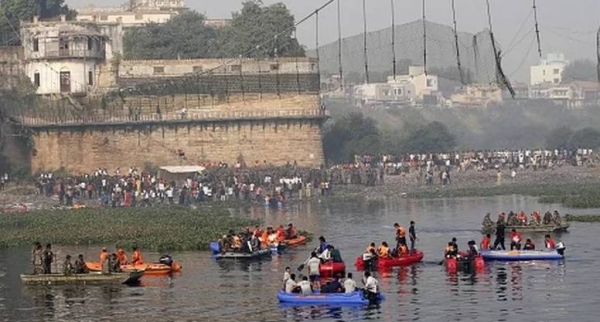 Rescue personnel conduct search operations after a bridge across the river Machchhu collapsed at Morbi in India's Gujarat state on October 31, 2022