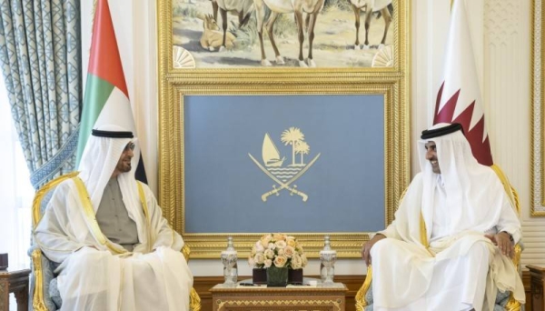 Sheikh Mohamed bin Zayed Al Nahyan and Sheikh Tamim bin Hamad Al Thani during a reception, at the Amiri Diwan.