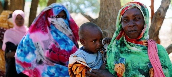 Women line up for WFP distribution of cash assistance at a displaced persons camp in South Darfur, Sudan. — courtesy WFP/Leni Kinzli