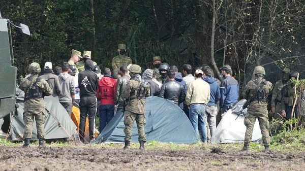 Polish security forces block migrants stuck on the border with Belarus in Usnarz Gorny, Poland.