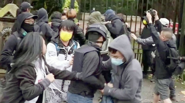 A still from a video shows a scuffle outside the Chinese consulate in Manchester.