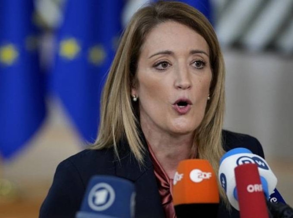 Roberta Metsola speaks with the media as she arrives for an EU summit in Brussels, Thursday