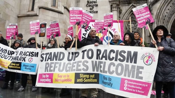 Members of the Stand up to Racism protest group outside the Royal Courts of Justice on Monday. — courtesy photo EPA