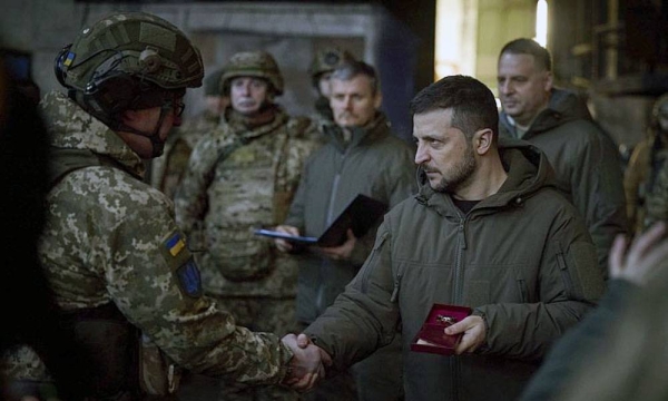 Ukrainian President Volodymyr Zelensky, right, awards a serviceman at the site of the heaviest battles with the Russian invaders in Bakhmut. — courtesy photo Ukrainian Presidential Press Office