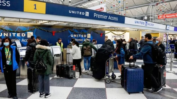 Passengers check into their flights at O'Hare International Airport, Chicago. — courtesy EPA