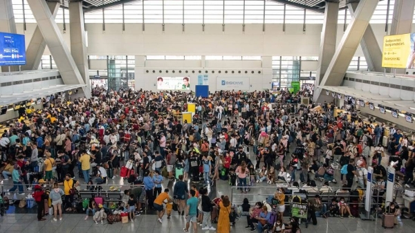 Passengers wait for information about their flights at the of Ninoy Aquino International Airport in Metro Manila, Philippines on January 1.