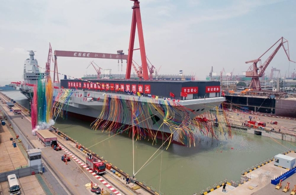 China's third aircraft carrier, the CNS Fujian, is towed out of its dry dock at China State Shipbuilding Corp's Jiangnan Shipyard Group in Shanghai at a launch ceremony. — courtesy Xinhua