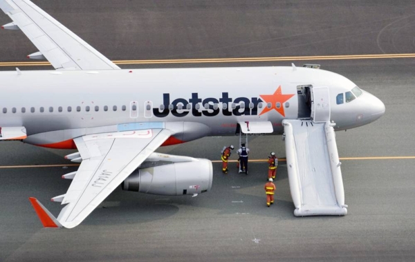 
Photo taken from a Kyodo News helicopter on Jan. 7, 2023, shows a Jetstar plane at Chubu Centrair International Airport in Tokoname, Aichi Prefecture, central Japan, after the budget carrier made an emergency landing following a bomb threat. — courtesy Kyodo