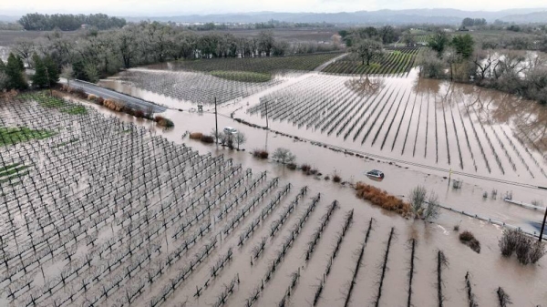 Cars are submerged in floodwater Monday in Windsor, California. — courtesy Justin Sullivan/Getty Images