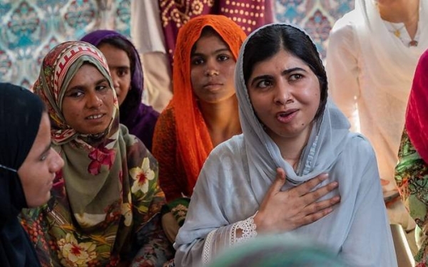 Malala talks with people affected by floods in Dadu district, Sindh province, Pakistan