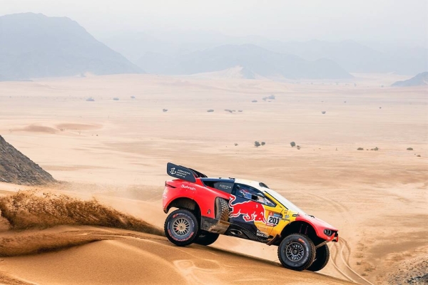 Carlos Sainz suffered a major crash six kilometers into the Dakar 2023 Stage 9 when his Audi rolled upside down while tackling a dune.