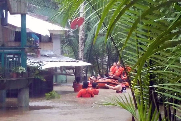 Flood rescue in Lamitan City, Basilan Province, Bangsamoro Region, Philippines, on Thursday. — courtesy Philippines Coast guard
