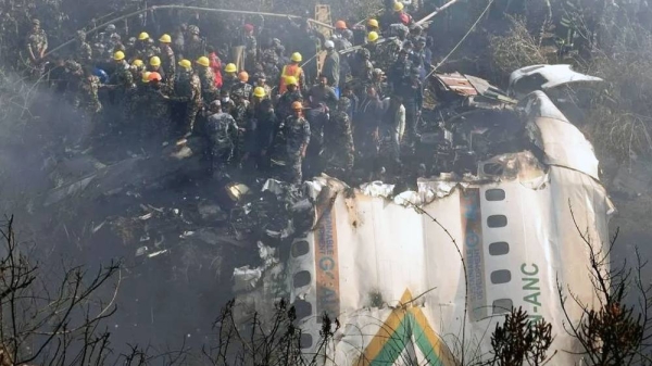 Rescue teams working near the wreckage at the crash site of a Yeti Airlines ATR72 aircraft in Pokhara, central Nepal, on Sunday. — courtesy EPA-EFE/REX/Shutterstock