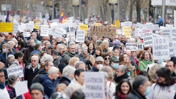 People gather during a protest in support of public health care in Madrid, Spain.