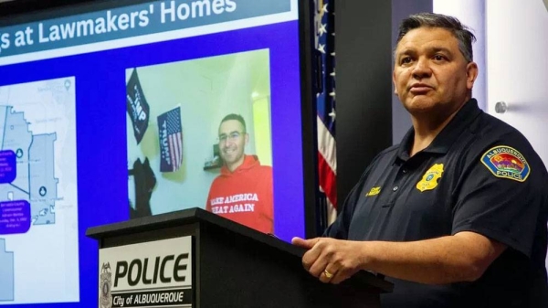 Police Chief Harold Medina in front of a photo of Pena. —courtesy photo