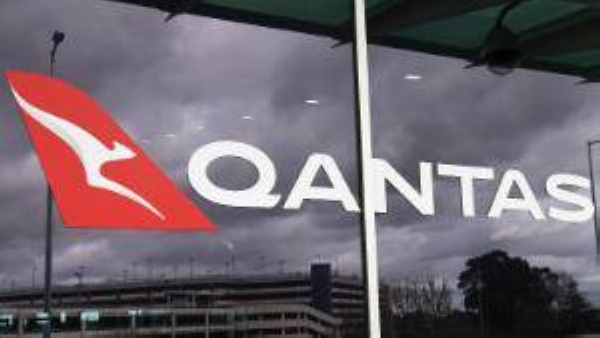 A Qantas logo adorns the side of the Qantas terminal at Melbourne Airport on August 20, 2020.