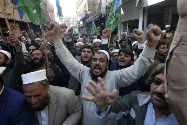 Supporters of Jamaat-e-Islami chant slogans during a protest  in Peshawar, Pakistan, against the desecration of the Holy Qur'an by anti-Islam activists in Europe, Friday