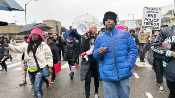 Protest organizer Casio Montez, in blue, leads a march in Memphis. — courtesy photo