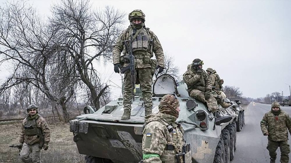 Ukrainian soldiers stand atop on APC before going to the frontline in Donetsk region Saturday. — courtesy AP /Andriy Dubchak