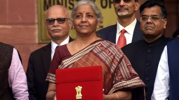 Finance Minister Nirmala Sitharaman holds a red folder containing Union Budget documents outside the Ministry of Finance in New Delhi on 1 February 2022.
