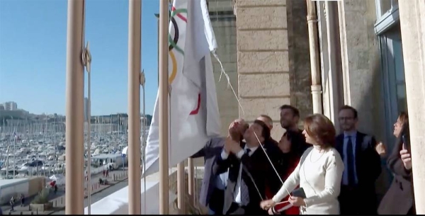 The Olympic flag is being raised in Paris.