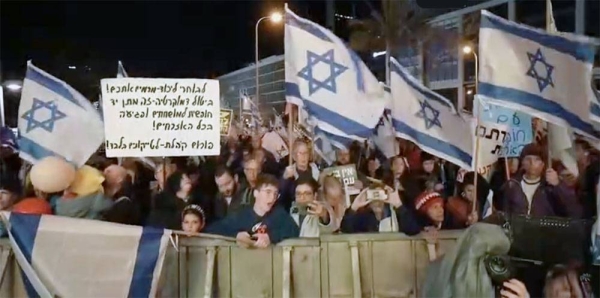 Israelis protest against the plans by Prime Minister Benjamin Netanyahu’s new government to overhaul the judicial system, in Tel Aviv, Israel, Saturday.