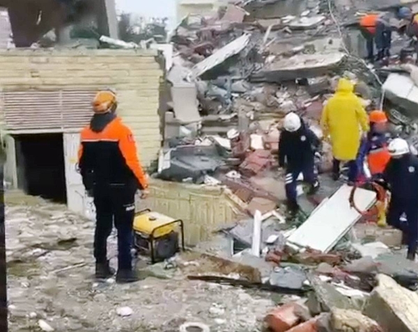 Rescue workers search the debris of an area in Gaziantep, where the epicenter of this mornings quake was situated.