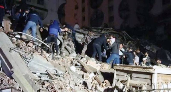 People search for survivors in the rubble in Diyarbakir, Turkey, which was devastated by a strong earthquake.