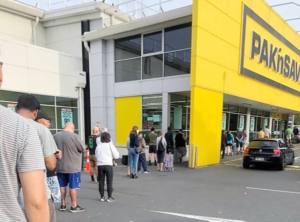 Long queues seen at a super market in New Zealand as people stock up prior to Cyclone Gabrielle.