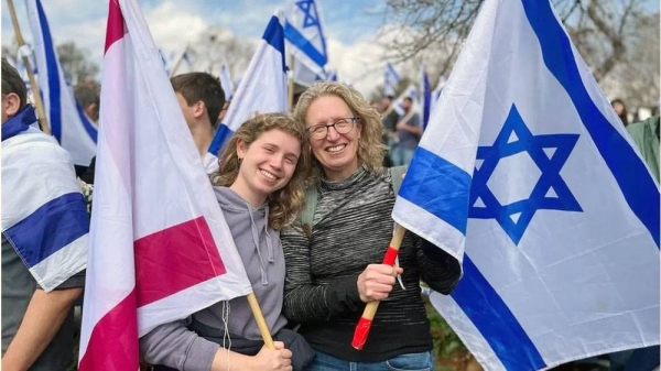 Protesters demonstrated outside parliament and around Israel on Monday. Picture shows Helit and daughter protesting.