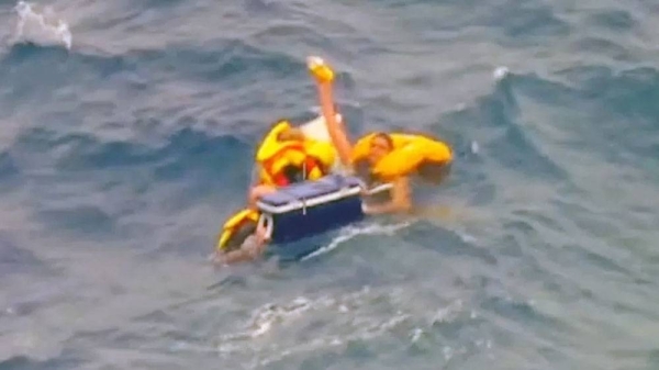 An aerial image of the three men floating at sea with the cooler. — courtesy Australian Maritime Safety Authority