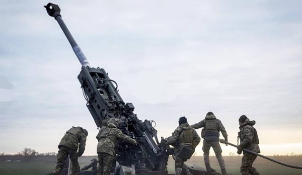 Ukrainian soldiers prepare a US-supplied M777 howitzer to fire at Russian positions in Kherson region, Ukraine, Jan. 9, 2023. — courtesy AP
