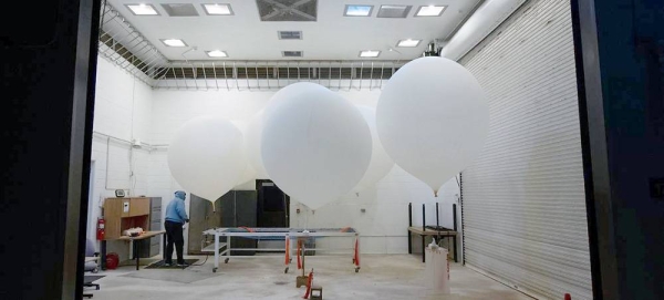 Weather balloons are prepared for release ahead of the launch of a NASA satellite. — courtesy NASA/Bill Ingalls