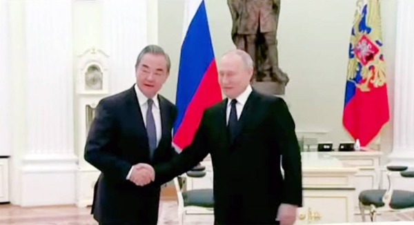 Vladimir Putin meets Wang Yi at the Kremlin in Moscow.