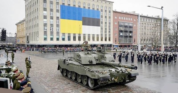 Tanks roll on Freedom Square at a military parade during celebrations of the 105th anniversary of the Republic of Estonia, in Tallinn, Estonia, Friday.
