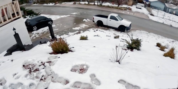 Rare snow carpets swaths of storm-hit California