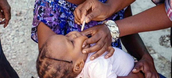 A young child is vaccinated against cholera in Haiti. — courtesy PAHO-WHO