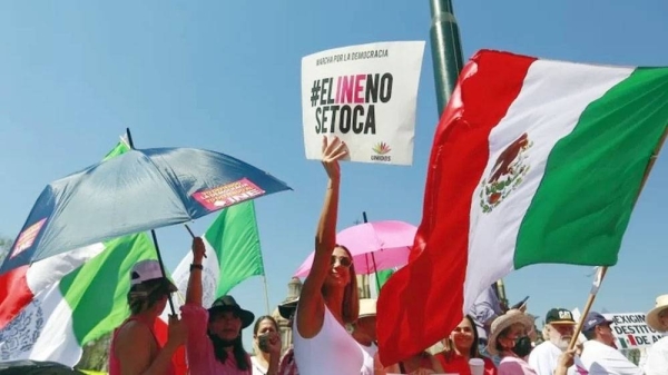 Protesters in Guadalajara with a slogan that reads in Spanish “Do not touch the INE”. — courtesy EPA