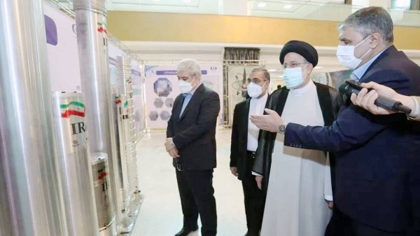 File photo showing Iranian President Ebrahim Raisi being shown uranium enrichment centrifuges at a conference in Tehran marking National Nuclear Technology Day (April 9, 2022). — courtesy Anadolu Agency