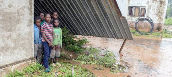 Children stand in the ruins of their school, destroyed by Cyclone Freddy in Mozambique. — courtesy UNICEF
