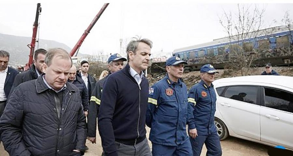 Greek Prime Minister Kyriakos Mitsotakis visits the location of train collision in Tempe, about 376 kilometers north of Athens, near Larissa city, Greece. — courtesy Dimtiris Papamitsos/AP