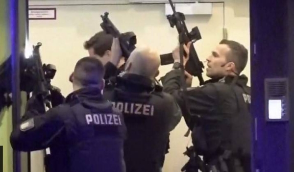 Armed police storm a building in Hamburg