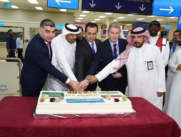 Passengers arriving aboard the Somon Air flight are being received at King Abdulaziz International Airport in Jeddah.