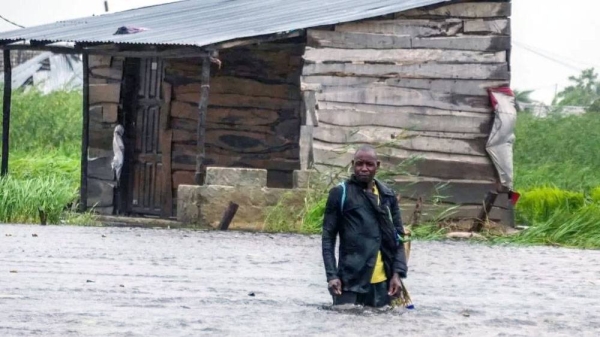 A man walks on a flooded street near Quelimane, Mozambique ob Saturday. — courtesy EPA